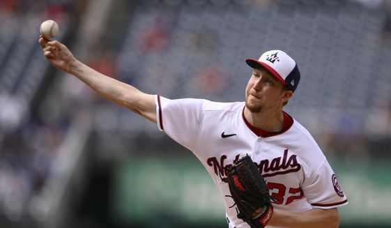 Washington Nationals starting pitcher Erick Fedde throws during the first inning of a baseball game against the Los Angeles Dodgers, Wednesday, May 25, 2022, in Washington. (AP Photo/Nick Wass)
