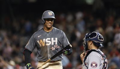 Outfielder Juan Soto (#22) chats with the Houston Astros catcher before taking the plate at Washington Nationals vs. Houston Astros on May 14th 2022 at Nationals Park in Washington, D.C. (Photo: All-Pro Reels/ Alyssa Howell)