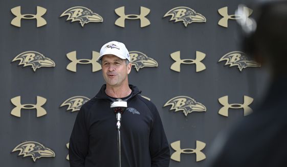Baltimore Ravens head coach John Harbaugh answers question after an NFL football practice Wednesday, May 25, 2022, in Owings Mills, Md. (AP Photo/Gail Burton)