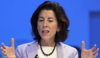 U.S. Secretary of Commerce Gina Raimondo attends a panel session at the World Economic Forum in Davos, Switzerland, Wednesday, May 25, 2022. The annual meeting of the World Economic Forum is taking place in Davos from May 22 until May 26, 2022. (AP Photo/Markus Schreiber)