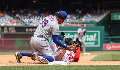 Outfielder Juan Soto (#22) slides/collides into Mets Pitcher Taijuan Walker (#99) at third base at Washington Nationals vs New York Mets on May 12th 2022 (Photography: All-Pro Reels/Alyssa Howell) **FILE**
