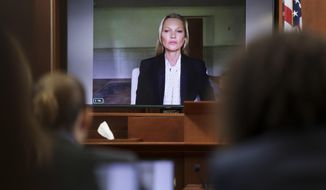 Model Kate Moss, a former girlfriend of actor Johnny Depp, testifies via video link at the Fairfax County Circuit Courthouse in Fairfax, Va., Wednesday, May 25, 2022. Depp sued his ex-wife Amber Heard for libel in Fairfax County Circuit Court after she wrote an op-ed piece in The Washington Post in 2018 referring to herself as a &amp;quot;public figure representing domestic abuse.&amp;quot; (Evelyn Hockstein/Pool photo via AP)