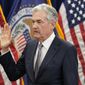 Federal Reserve Board Chair Jerome Powell takes the oath of office for his second term, Monday, May 23, 2022, in Washington. (AP Photo/Patrick Semansky)