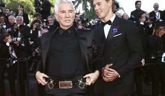 Director Baz Luhrmann, left, and Austin Butler pose for photographers upon arrival at the premiere of the film &#39;Elvis&#39; at the 75th international film festival, Cannes, southern France, Wednesday, May 25, 2022. (Photo by Joel C Ryan/Invision/AP)