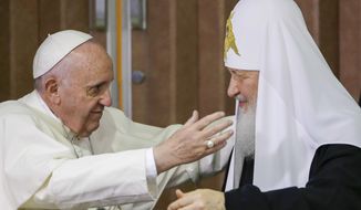 Pope Francis, left, reaches to embrace Russian Orthodox Patriarch Kirill after signing a joint declaration at the Jose Marti International airport in Havana, Cuba o Feb. 12, 2016. Pope Francis has sent a protocol greeting to the head of the Russian Orthodox Church, wishing him prayers on a feast day, as the Vatican insists on maintaining cordial relations amid mounting criticism of its stance from within the Catholic hierarchy. The website of the Moscow Patriarchate published the brief letter of greetings Francis sent Patriarch Kirill on his name day Tuesday to mark the feast of St. Cyril, a saint important to both Catholics and Orthodox. (AP Photo/Gregorio Borgia, Pool)