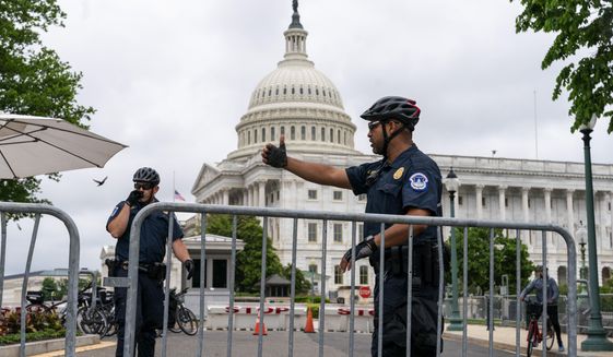 An entrance to the U.S. Capitol is secured ahead of an abortion rights demonstrators march, Saturday, May 14, 2022, to the Supreme Court in Washington, during protests across the country. (AP Photo/Jacquelyn Martin)