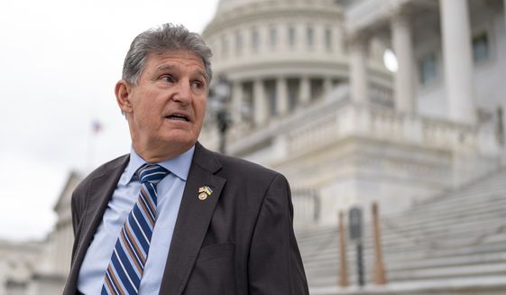 Sen. Joe Manchin, D-W.Va., departs as the Senate breaks for the Memorial Day recess, at the Capitol in Washington, Thursday, May 26, 2022. Democrats’ first attempt at responding to the back-to-back mass shootings in Buffalo and Uvalde, Texas, has failed in the Senate. Republicans on Thursday blocked debate on a domestic terrorism bill that would have opened debate on domestic terrorism, hate crimes and gun policy. (AP Photo/J. Scott Applewhite) **FILE**