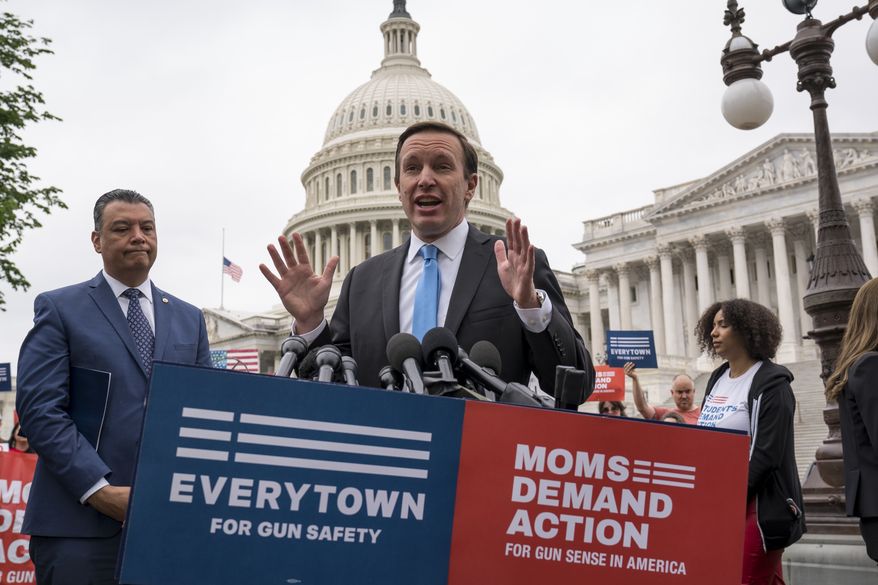 Sen. Chris Murphy, D-Conn., is joined at left by Sen. Alex Padilla, D-Calif., as they speak to activists demanding action on gun control legislation after a gunman killed 19 children and two teachers in a Texas elementary school this week, at the U.S. Capitol in Washington, Thursday, May 26, 2022. (AP Photo/J. Scott Applewhite) ** FILE **