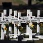 Crosses with the names of Tuesday&#39;s shooting victims are placed outside Robb Elementary School in Uvalde, Texas, Thursday, May 26, 2022. (AP Photo/Jae C. Hong)