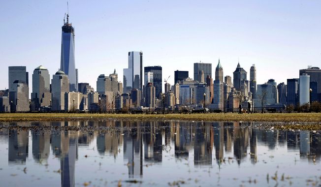 New York&#x27;s Lower Manhattan skyline, including the One World Trade Center, left, is reflected in water on April 6, 2013, as seen from Liberty State Park in Jersey City, N.J. Eight of the 10 largest cities in the U.S. lost population during the first year of the pandemic, with only Phoenix and San Antonio gaining new residents from 2020 to 2021, according to new estimates released, Thursday, May 26, 2022, by the U.S. Census Bureau. (AP Photo/Mel Evans, File)