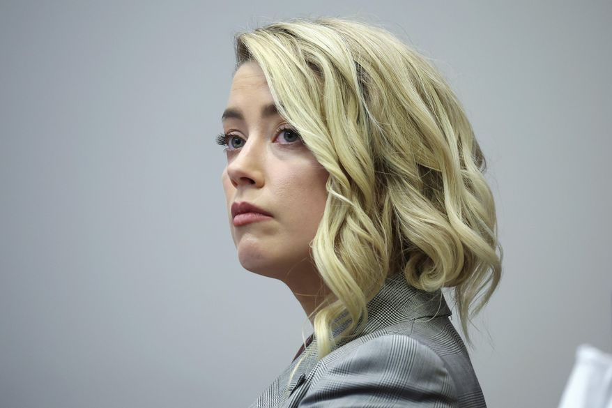 Actor Amber Heard appears in the courtroom in the Fairfax County Circuit Courthouse in Fairfax, Va., Thursday, May 26, 2022. Actor Johnny Depp sued his ex-wife Amber Heard for libel in Fairfax County Circuit Court after she wrote an op-ed piece in The Washington Post in 2018 referring to herself as a &amp;quot;public figure representing domestic abuse.&amp;quot; (Michael Reynolds/Pool Photo via AP)