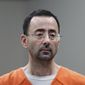 Dr. Larry Nassar appears in court for a plea hearing on Nov. 22, 2017, in Lansing, Mich. The U.S. Justice Department said Thursday, May 26, 2022, it will not pursue criminal charges against former FBI agents who failed to quickly open an investigation of the sports doctor despite learning in 2015 that he was accused of sexually assaulting female gymnasts. (AP Photo/Paul Sancya File)