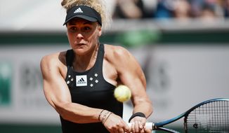 France&#39;s Leolla Jeanjean plays a shot against Karolina Pliskova of the Czech Republic during their second round match at the French Open tennis tournament in Roland Garros stadium in Paris, France, Thursday, May 26, 2022. (AP Photo/Thibault Camus)