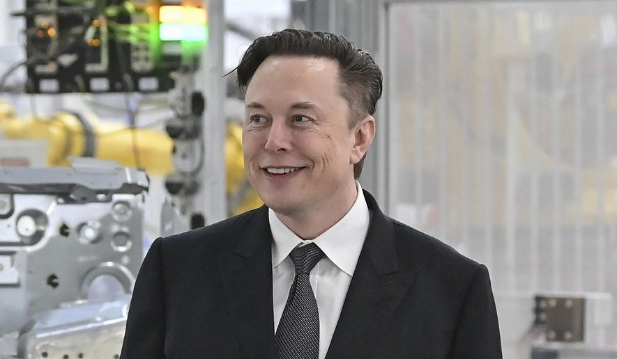 Tesla CEO Elon Musk attends the opening of the Tesla factory Berlin Brandenburg in Gruenheide, Germany, March 22, 2022. Twitter shareholders have filed a lawsuit accusing Musk of engaged in “unlawful conduct” aimed at sowing doubt about his bid to buy the social media company. The lawsuit filed late Wednesday, May 25, in the U.S. District Court for the Northern District of California claims the billionaire Tesla CEO has sought to drive down Twitter’s stock price because he wants to walk away from the deal or negotiate a substantially lower purchase price. (Patrick Pleul/Pool Photo via AP, File)