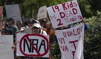 People protest the National Rifle Association&#39;s annual meeting in Houston, Friday, May 27, 2022. (AP Photo/Jae C. Hong)