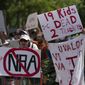 People protest the National Rifle Association&#39;s annual meeting in Houston, Friday, May 27, 2022. (AP Photo/Jae C. Hong)