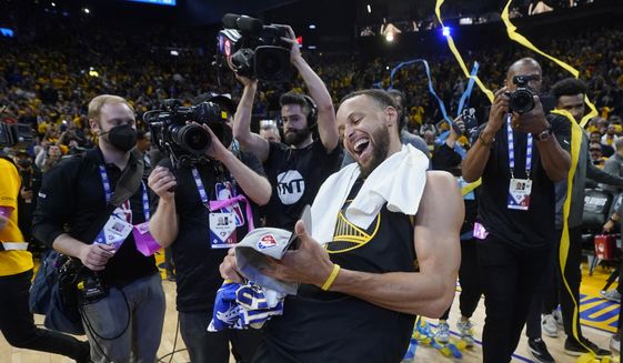 Golden State Warriors guard Stephen Curry celebrates after the Warriors defeated the Dallas Mavericks in Game 5 of the NBA basketball playoffs Western Conference finals in San Francisco, Thursday, May 26, 2022. (AP Photo/Jeff Chiu) **FILE**