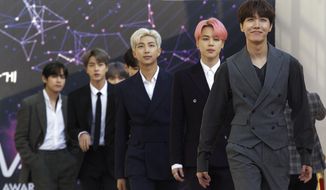 In this April 24, 2019, photo, members of South Korean K-Pop group BTS arrive to attend The Fact Music Awards in Incheon, South Korea. BTS will reveal their gradual journey to becoming K-pop superstars through a new Apple Music weekly limited series. The streaming service announced Thursday, May 26, 2022 that BTS will launch their new show “BTS Radio: Past &amp;amp; Present” on Apple Music 1. (AP Photo/Ahn Young-joon, File)
