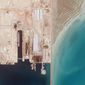 This satellite photo from Planet Labs PBC shows the Iranian Revolutionary Guard&#39;s newest ship, the Shahid Mahdavi, center right, under construction in a shipyard west of Bandar Abbas, Iran, Saturday, May 21, 2022. Iran&#39;s paramilitary Revolutionary Guard is building the massive new support ship near the strategic Strait of Hormuz as it tries to expand its naval presence in waters vital to international energy supplies and beyond, satellite photos obtained by The Associated Press show. (Planet Labs PBC via AP)