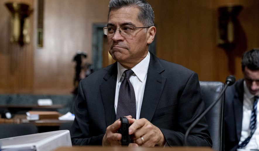 FILE - Health and Human Services Secretary Xavier Becerra arrives for a hearing on Capitol Hill in Washington, April 5, 2022. Medicare recipients will get a premium reduction — but not until next year. That reflects what Becerra says was an overestimate in costs of covering a costly and controversial new Alzheimer&#39;s drug. (AP Photo/Andrew Harnik, File)