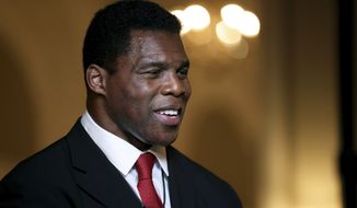 Herschel Walker speaks to members of the media after his Republican Primary win on Tuesday, May 24, 2022, at the Georgian Terrace Hotel in Atlanta. Walker will represent the Republican Party in its efforts to unseat Democratic Sen. Raphael Warnock in November. (Jason Getz/Atlanta Journal-Constitution via AP, File)