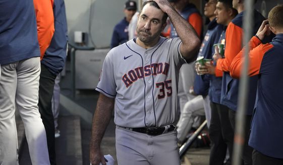 Houston Astros starting pitcher Justin Verlander walks in the dugout after pitching in the sixth inning of the team&#39;s baseball game against the Seattle Mariners, Friday, May 27, 2022, in Seattle. (AP Photo/Ted S. Warren)