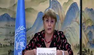 In this image made from online video, United Nations High Commissioner for Human Rights Michelle Bachelet speaks during an online press conference in Guangzhou in southern China&#39;s Guangdong Province, Saturday, May 28, 2022. Bachelet is on a six-day visit to China that includes Xinjiang, a region where the Chinese government has been accused of human rights violations. (United Nations High Commissioner for Human Rights via AP)