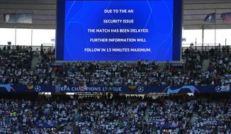 The display announces delay of the Champions League final soccer match between Liverpool and Real Madrid at the Stade de France in Saint Denis near Paris, Saturday, May 28, 2022. (AP Photo/Petr David Josek)