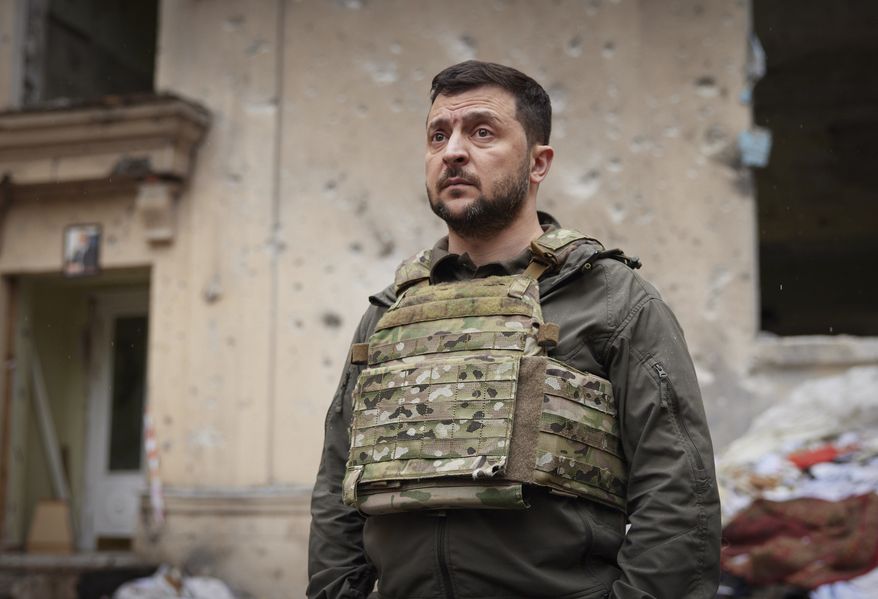 In this photo provided by the Ukrainian Presidential Press Office on Sunday, May 29, 2022, Ukrainian President Volodymyr Zelenskyy looks on as he visits the war-hit Kharkiv region. Zelenskyy described the situation in the east as "indescribably difficult." The "Russian army is trying to squeeze at least some result" by concentrating its attacks there, he said in a Saturday night video address. (Ukrainian Presidential Press Office via AP)