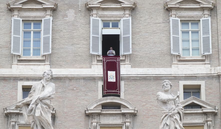 Pope Francis delivers the Regina Coeli noon prayer from his studio window overlooking St. Peter&#x27;s Square at the Vatican, Sunday, 29, 2002. (AP Photo/Gregorio Borgia)