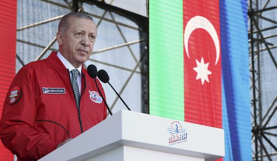 Turkey&#39;s President Recep Tayyip Erdogan speaks at a Turkish Technology and Aviation festival, held abroad for the first time, in Baku, Azerbaijan, Saturday, May 28, 2022. (Turkish Presidency via AP)