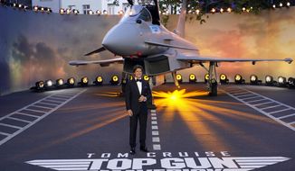 Tom Cruise poses for the media during the &#x27;Top Gun Maverick&#x27; UK premiere at a central London cinema, on Thursday, May 19, 2022. (AP Photo/Alberto Pezzali)