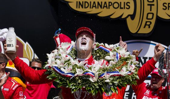 Marcus Ericsson, of Sweden, celebrates after winning the Indianapolis 500 auto race at Indianapolis Motor Speedway in Indianapolis, Sunday, May 29, 2022. (AP Photo/Michael Conroy)
