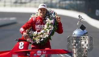 Marcus Ericsson, of Sweden, poses with the Borg-Warner Trophy during the traditional winners photo session at Indianapolis Motor Speedway in Indianapolis, Monday, May 30, 2022. Ericsson won the 106th running of the Indianapolis 500 auto race Sunday. (AP Photo/Michael Conroy) **FILE**