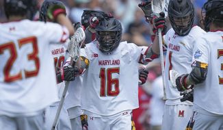 Maryland attack Anthony DeMaio (16) celebrates his goal against Cornell during the first half of the NCAA college men&#x27;s lacrosse championship game, Monday, May 30, 2022, in East Hartford, Conn. (AP Photo/Bryan Woolston)
