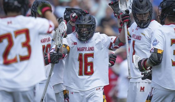 Maryland attack Anthony DeMaio (16) celebrates his goal against Cornell during the first half of the NCAA college men&#39;s lacrosse championship game, Monday, May 30, 2022, in East Hartford, Conn. (AP Photo/Bryan Woolston)