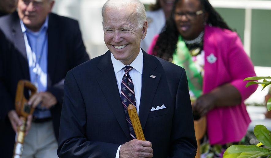 President Joe Biden participates in a magnolia tree planting ceremony on the South Lawn of the White House in Washington, Monday, May 30, 2022. (AP Photo/Andrew Harnik)