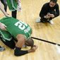 Boston Celtics center Al Horford (42) falls to his knees after winning Game 7 of the NBA basketball Eastern Conference finals playoff series against the Miami Heat, Sunday, May 29, 2022, in Miami. (AP Photo/Lynne Sladky) **FILE**