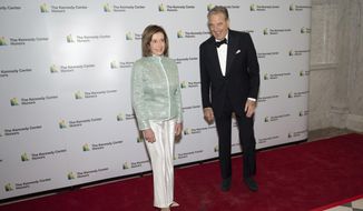 House Speaker Nancy Pelosi, D-Calif., and her husband, Paul Pelosi, pose on the red carpet at the Medallion Ceremony for the 44th Annual Kennedy Center Honors on Saturday, Dec. 4, 2021, at the Library of Congress in Washington. Authorities say Paul Pelosi was arrested on suspicion of DUI in Northern California, late Saturday, May 28, 2022, in Napa County. He could face charges including driving under the influence. Bail was set at $5,000. (AP Photo/Kevin Wolf)