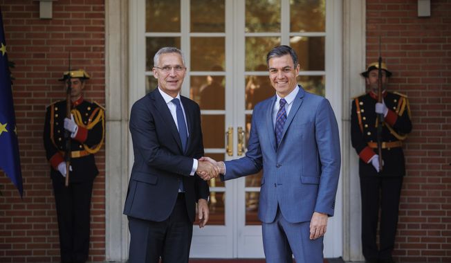 NATO Secretary General Jens Stoltenberg, left, shakes hand with Spanish Prime Minister Pedro Sánchez during their meeting in Madrid, Monday, May. 30, 2022. Stoltenberg visits Madrid for Spain&#x27;s celebration of its 40th year as part of the military alliance one month before the capital hosts an important NATO summit. (Alejandro Martínez, Europa Press via AP)
