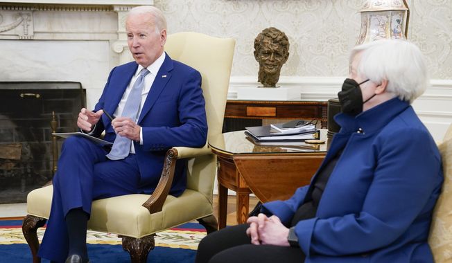President Joe Biden meets with Treasury Secretary Janet Yellen, right, in the Oval Office of the White House, Tuesday, May 31, 2022, in Washington. (AP Photo/Evan Vucci)