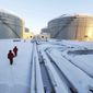In this photo released by China&#39;s Xinhua News Agency, workers inspect the pipelines and oil storage tanks of a nearly 625-miles-long China and Russia crude oil pipeline in Mohe, northeast China&#39;s Heilongjiang Province on Jan. 1, 2011. China’s support for Russia through oil and gas purchases is irking Washington and raising the risk of U.S. retaliation, foreign observers say, though they see no sign Beijing is helping Moscow evade sanctions over its war on Ukraine. (Wang Jianwei/Xinhua via AP, File)