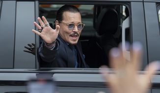 Actor Johnny Depp waves to supporters as he departs the Fairfax County Courthouse Friday, May 27, 2022 in Fairfax, Va.  A jury heard closing arguments in Johnny Depp&#39;s high-profile libel lawsuit against ex-wife Amber Heard. Lawyers for Johnny Depp and Amber Heard made their closing arguments to a Virginia jury in Depp&#39;s civil suit against his ex-wife.(AP Photo/Craig Hudson)