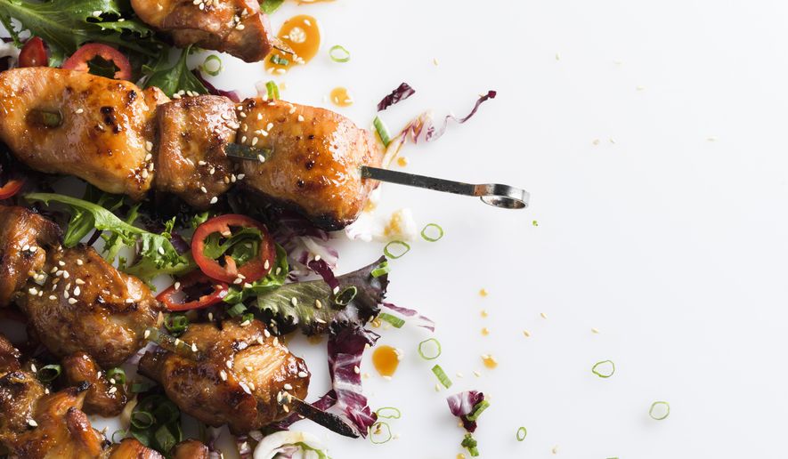 This image released by Milk Street shows a recipe for Maple and Soy-Glazed Chicken Skewers. (Milk Street via AP)