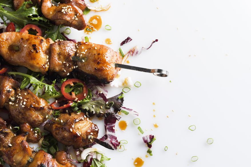 This image released by Milk Street shows a recipe for Maple and Soy-Glazed Chicken Skewers. (Milk Street via AP)