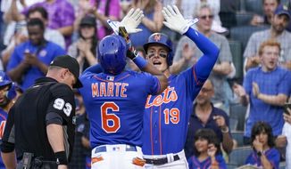 New York Mets&#39; Starling Marte (6) and Mark Canha (19) celebrate after scoring nf Marte&#39;s two-run home run during the first inning of the team&#39;s baseball game against the Washington Nationals, Tuesday, May 31, 2022, in New York. (AP Photo/Mary Altaffer)