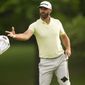 Dustin Johnson tosses his towel to his caddie on the 10th hole during the second round of the PGA Championship golf tournament at Southern Hills Country Club, Friday, May 20, 2022, in Tulsa, Okla. (AP Photo/Matt York) ** FILE**