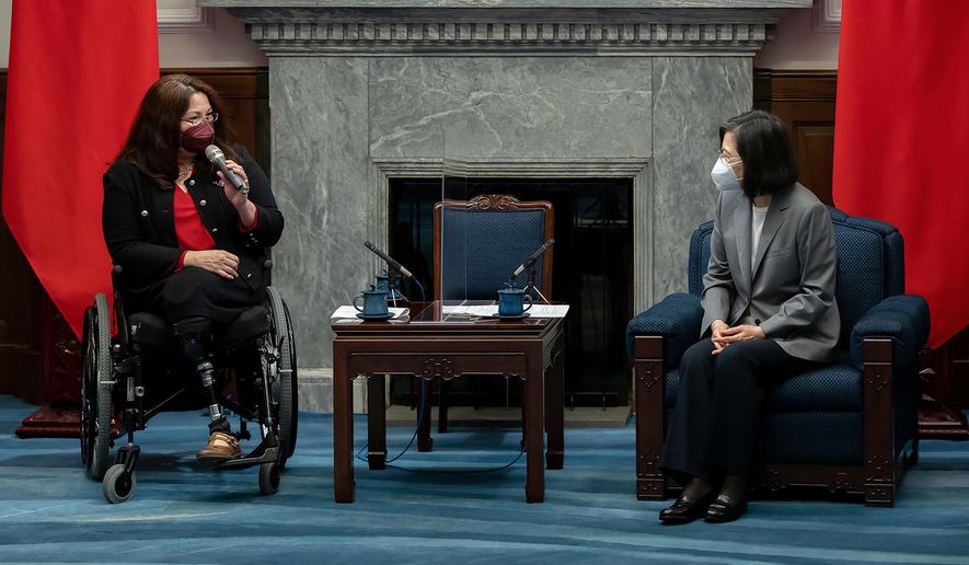 In this photo released by the Taiwan Presidential Office, U.S. Sen. Tammy Duckworth, D-Ill., left, meets with Taiwan&#x27;s President Tsai Ing-wen at the Presidential Office in Taipei, Taiwan, Tuesday, May 31, 2022. On a visit to Taiwan, reiterated support for the island amid rising Chinese threats. (Taiwan Presidential Office via AP)