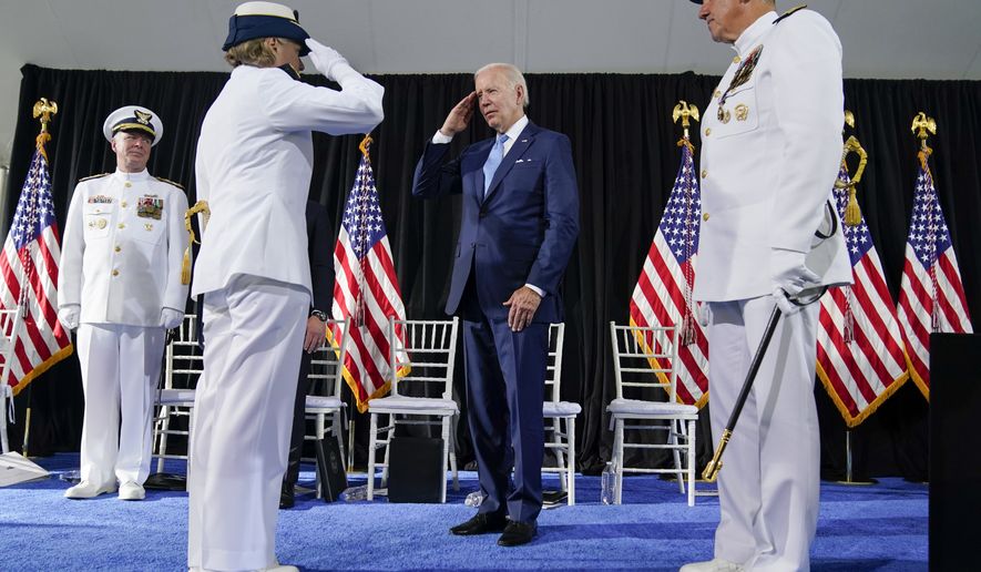 President Joe Biden returns a salute from Adm. Linda Fagan, second from left, during a change of command ceremony at U.S. Coast Guard headquarters, Wednesday, June 1, 2022, in Washington. Adm. Karl L. Schultz, at right, is being relieved by Adm. Linda Fagan as the Commandant of the U.S. Coast Guard. (AP Photo/Evan Vucci)