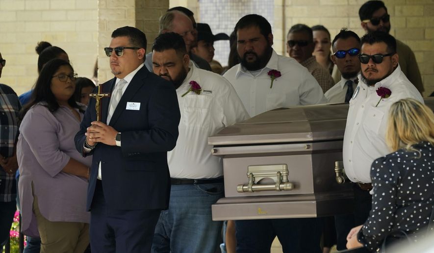 Pallbearers carry the casket of Amerie Jo Garza following funeral services at Sacred Heart Catholic Church, Tuesday, May 31, 2022, in Uvalde, Texas. Garza was killed in last week&#x27;s elementary school shooting, (AP Photo/Eric Gay)